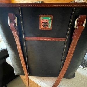 Dooney & Bourke EPI black leather purse with brown leather edging.